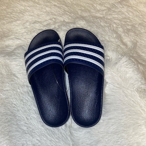 navy blue adidas slides